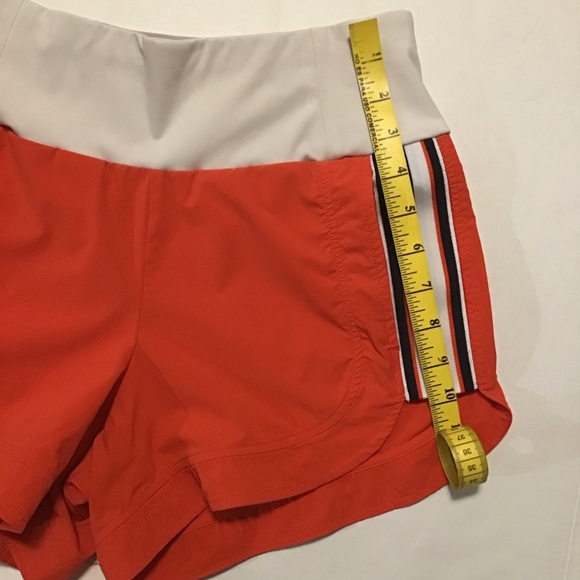 Athleta Ascender Athletic Shorts Orange - Picture 3 of 9